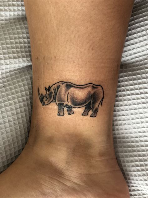 Rhino Tattoo | Rhino tattoo, Spine tattoos for women, Ink tattoo