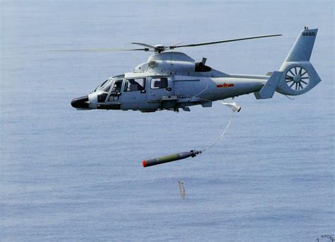 A PLA-N Z-9 multipurpose helicopter drops a torpedo during ASW training exercises [1340x968 ...