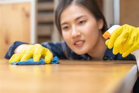 Cleaning Hygiene, Close Up Hand of Maid, Waitress Woman Wearing Yellow Protective Gloves while ...