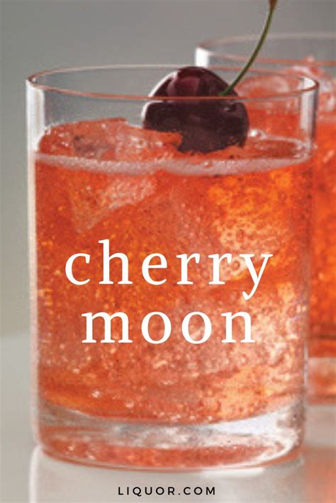 two glasses filled with ice and cherries on top of a white countertop next to the words cherry moon