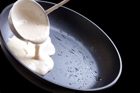 Pour Batter into the Pan. on a Black Background Stock Photo - Image of ...