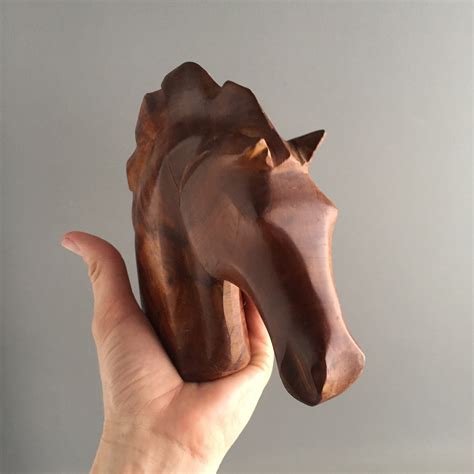 carved wooden horse head sculpture