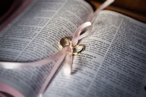 Wedding Rings in Holy Bible in Catholic Church Stock Photo - Image of catholic, cross: 193640362