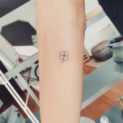 Minimalist four leaf clover tattoo on the inner