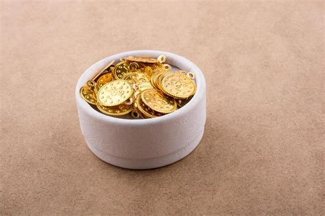 Fake gold coins in a box 14840886 Stock Photo at Vecteezy