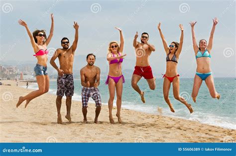People jumping at beach stock image. Image of summer - 55606389