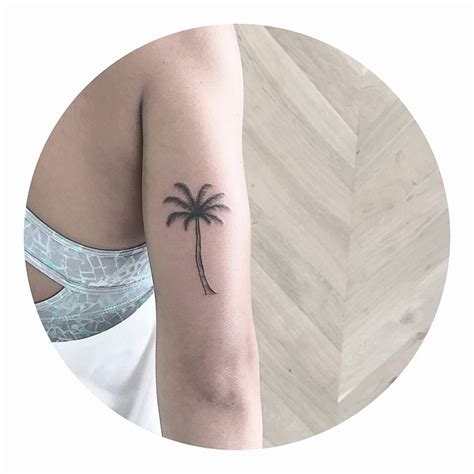 Small palm tree by artist Cholo - Tattoogrid.net