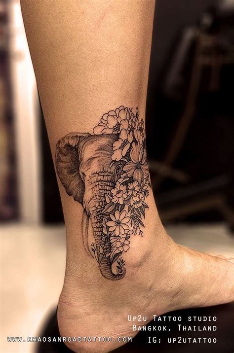 Elephant with flowers Tattoo - khaosanroadtattoo