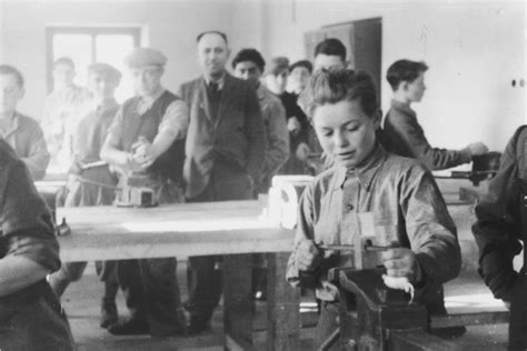 Young men study locksmithing in a vocational workshop in either the Foehrenwald or Windsheim ...