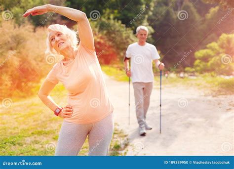 Elderly Woman Doing Exercises Outdoors Stock Photo - Image of aging, pensioners: 109389950