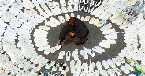 Kanye West Poses With All His Yeezy Shoes