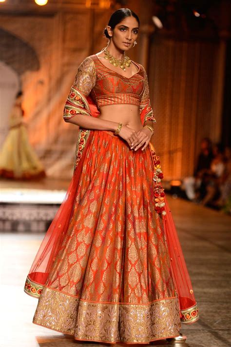 Orange and gold applique work printed lehenga set By Reynu Tandon Pakistani Party Wear ...