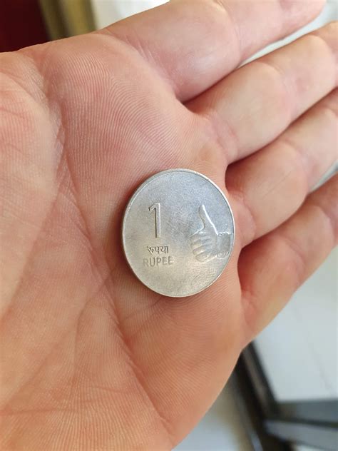 The Indian 1 rupee coin just has a dude giving a thumbs up on it : r/mildlyinteresting