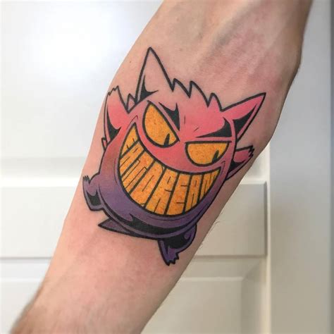 Gengar Pokémon tattoo on the right inner forearm.