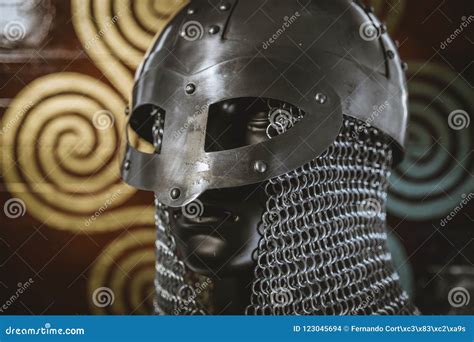 Viking Warrior Helmet with Chainmail Over Shield with Drawings a Stock ...