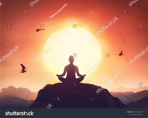 Woman Practices Yoga Meditates On Mountain Stock Photo 1055164238 ...