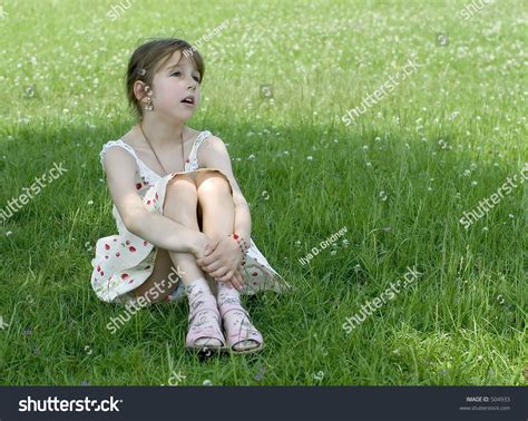 Little Girl Sitting On Grass Dreaming Stock Photo 504933 - Shutterstock