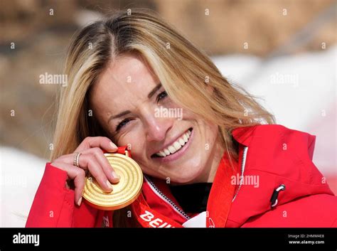 Beijing, China. 11th Feb, 2022. Lara Gut-Behrami of Switzerland shows off her gold medal in ...