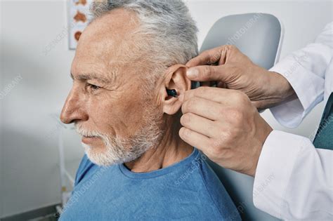 Intra-ear hearing aid fitting - Stock Image - F036/9272 - Science Photo Library