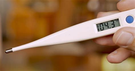 Hand Holding Digital Thermometer Displaying Stock Footage SBV-325765987 ...