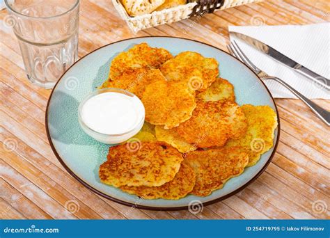 Draniki with Sour Cream at Plate, Dish of Belarusian Cuisine Stock ...