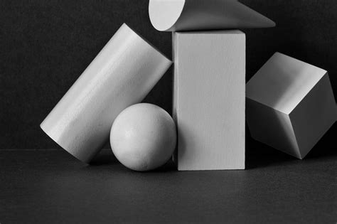 three different shapes are shown in black and white, with one ball at the top