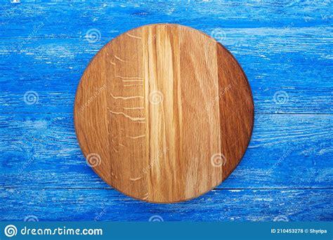 Empty Cutting Board in a Round Shape on a Blue Wooden Table. Space for Text Stock Photo - Image ...