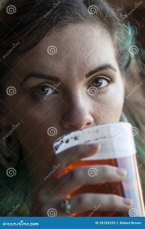 Young Woman Drinking Beer stock image. Image of pint - 28182229