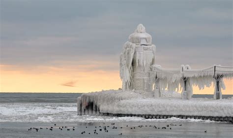 Frozen Lighthouse Majestic Beauty | Lighthouse, Great lakes, Around the ...