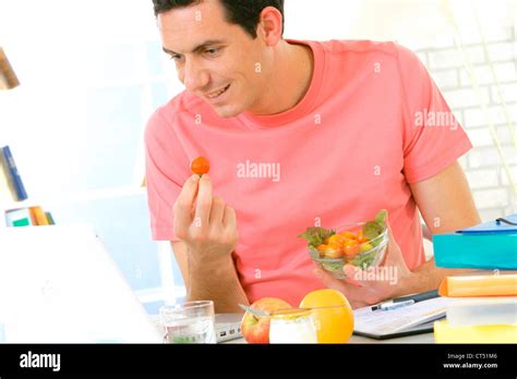 MAN EATING SALAD Stock Photo - Alamy