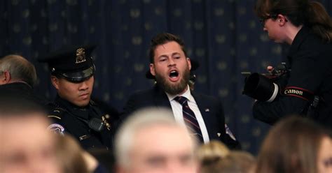 Protester at impeachment hearing: Owen Shroyer, Infowars host, interrupts start of House ...