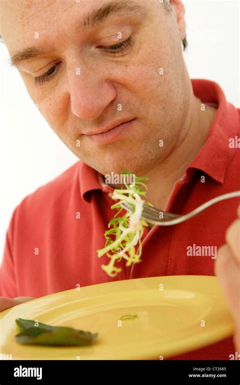 MAN EATING SALAD Stock Photo - Alamy