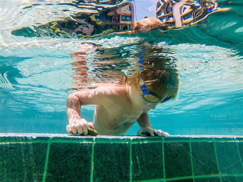 A child boy is swimming underwater stock photo containing under and water | High-Quality People ...