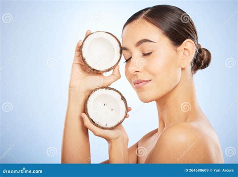 Skincare, Wellness and Face of Woman with Coconut on Blue Background for Dermatology, Body Care ...