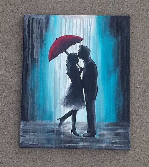 The Nicest Pictures: couple in the rain under a red umbrella