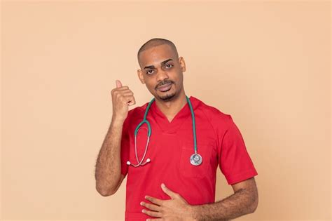 Premium Photo | African doctor wearing red uniform