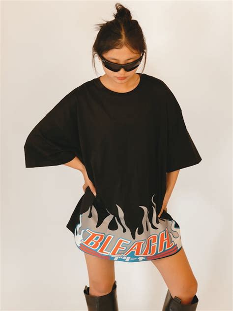 A woman in black t - shirt dress with flames on it · Free Stock Photo