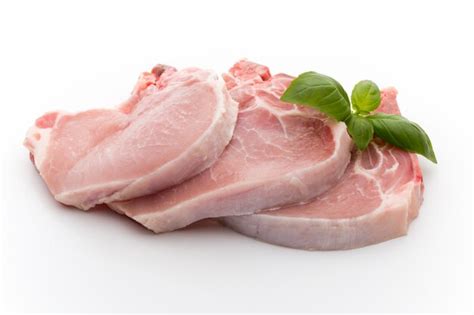 Premium Photo | Close-up of fresh and raw pork with basil