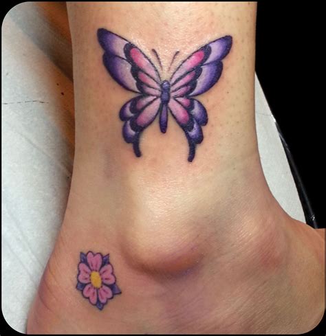 Purple butterfly tattoo, Tiny butterfly tattoo, Butterfly tattoo designs