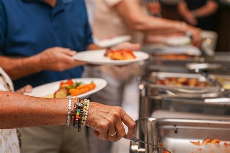 Premium Photo | Hand delicately savoring food representing the joy and ...