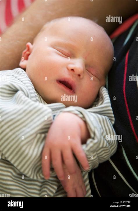 A sleeping one month old baby Stock Photo - Alamy