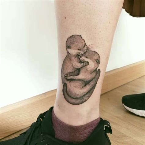 otters holding hands tattoo - vivaxpropaintinggrandjunction