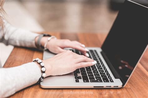 young-woman-working-typing-on-her-laptop_free_stock_photos_picjumbo ...