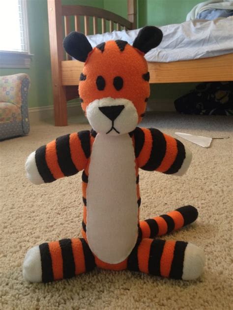 A stuffed Hobbes I made, almost entirely hand-sewn. The twist: I'm a ...