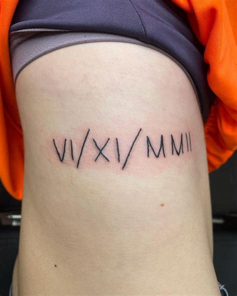 Roman Numerals Tattoo Forearm