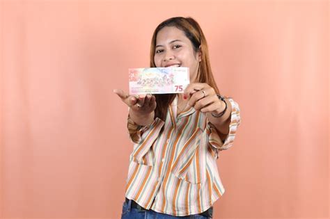 Premium Photo | Holding cash money in indonesian rupiah