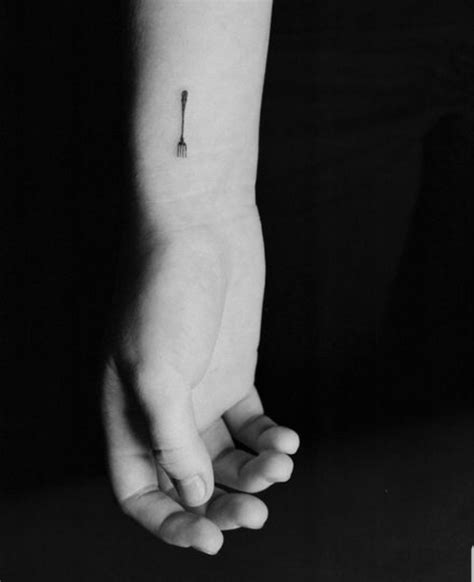 Elegant fork wrist tattoo