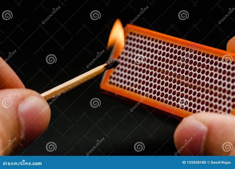 Man S Fingers Lighting A Match, Setting Fire On Friction. On A Black Background. Matches And ...