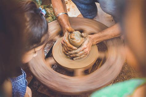 Person Making Clay Pot in Front of Girl during Daytime · Free Stock Photo