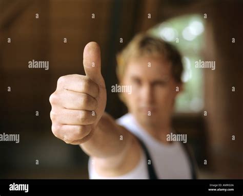 Young Craftsman measuring Stock Photo - Alamy